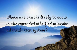 Where are cracks likely to occur in the expanded vitrified microbead insulation system?